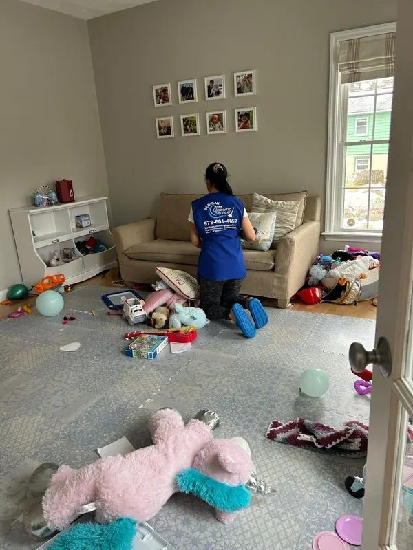 Bedigan cleaner picking up a playroom