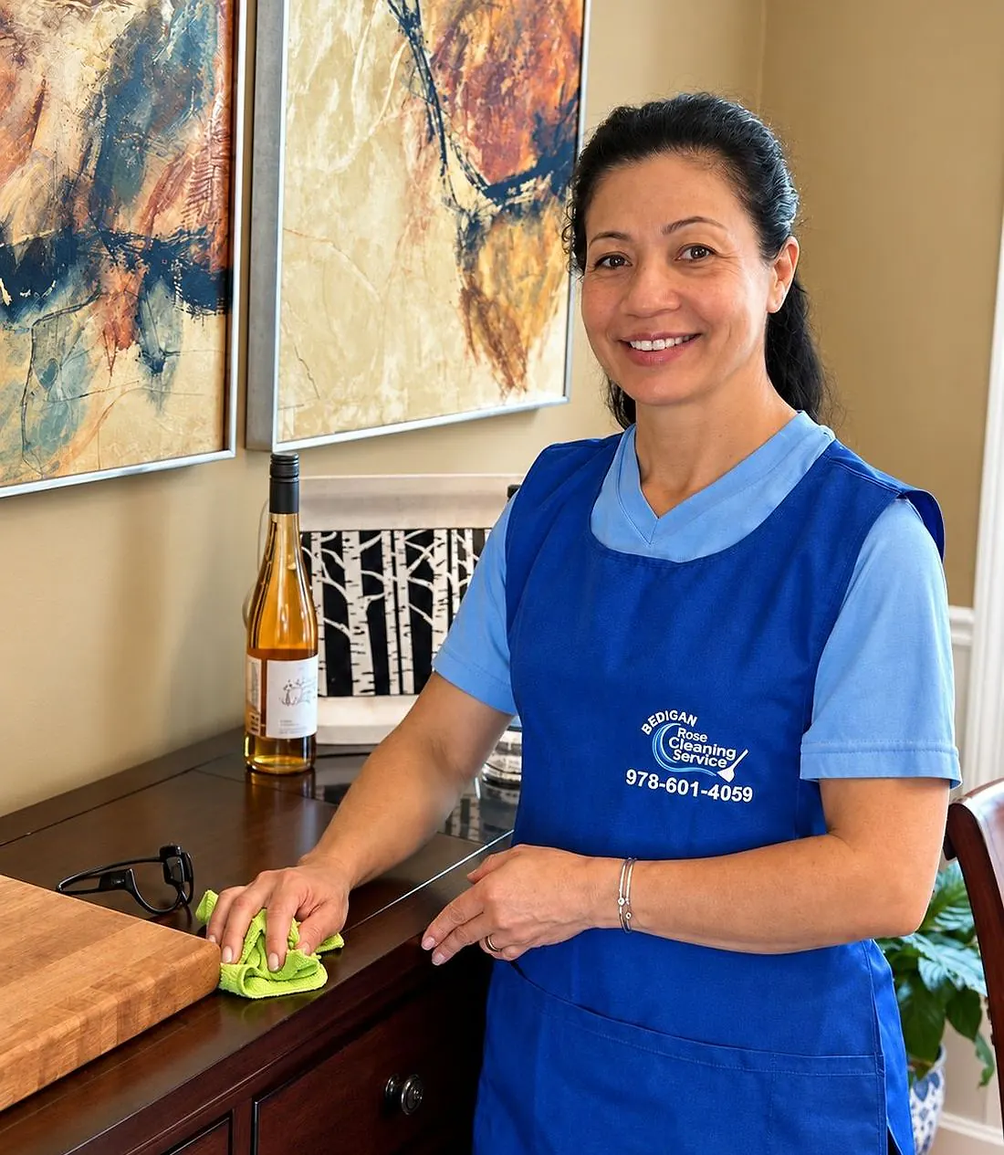 Rosinei, owner of Bedigan Cleaning Services, in the company apron